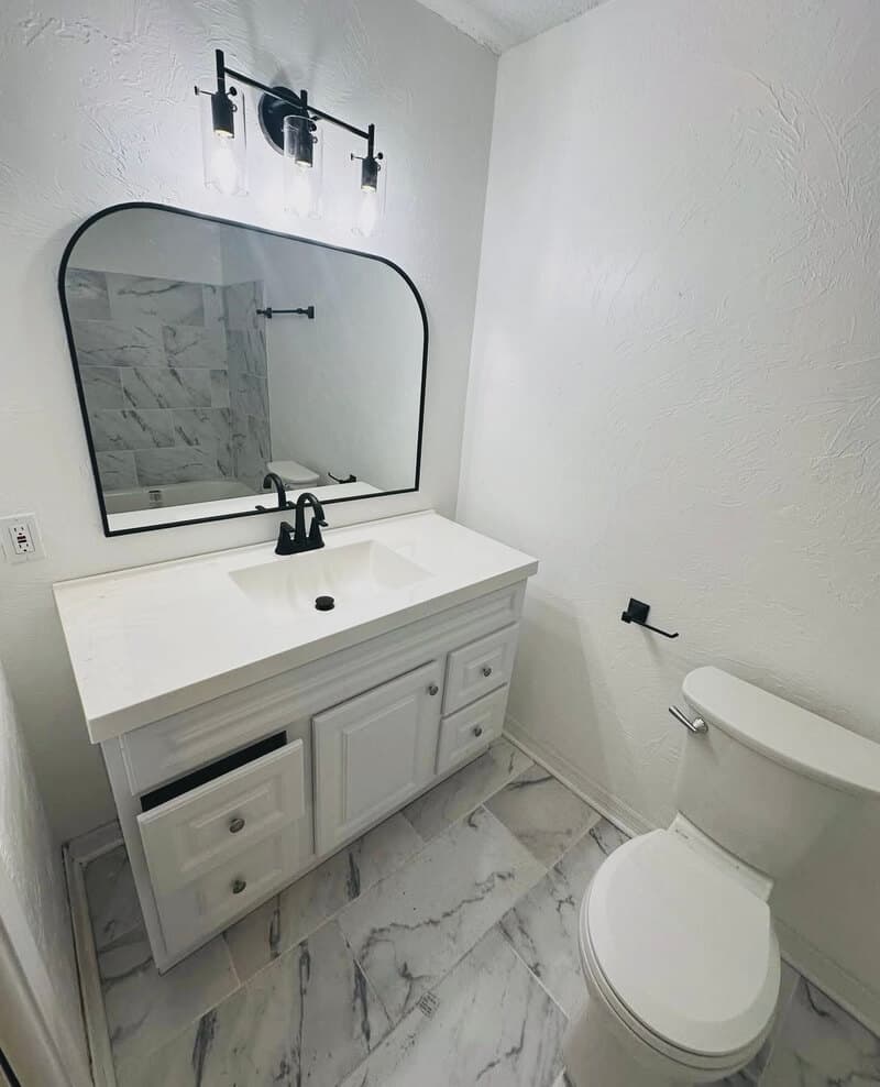 Professional bathroom remodeling project completed by GMZ Remodeling in Gainesville, FL showing modern fixtures and tile work